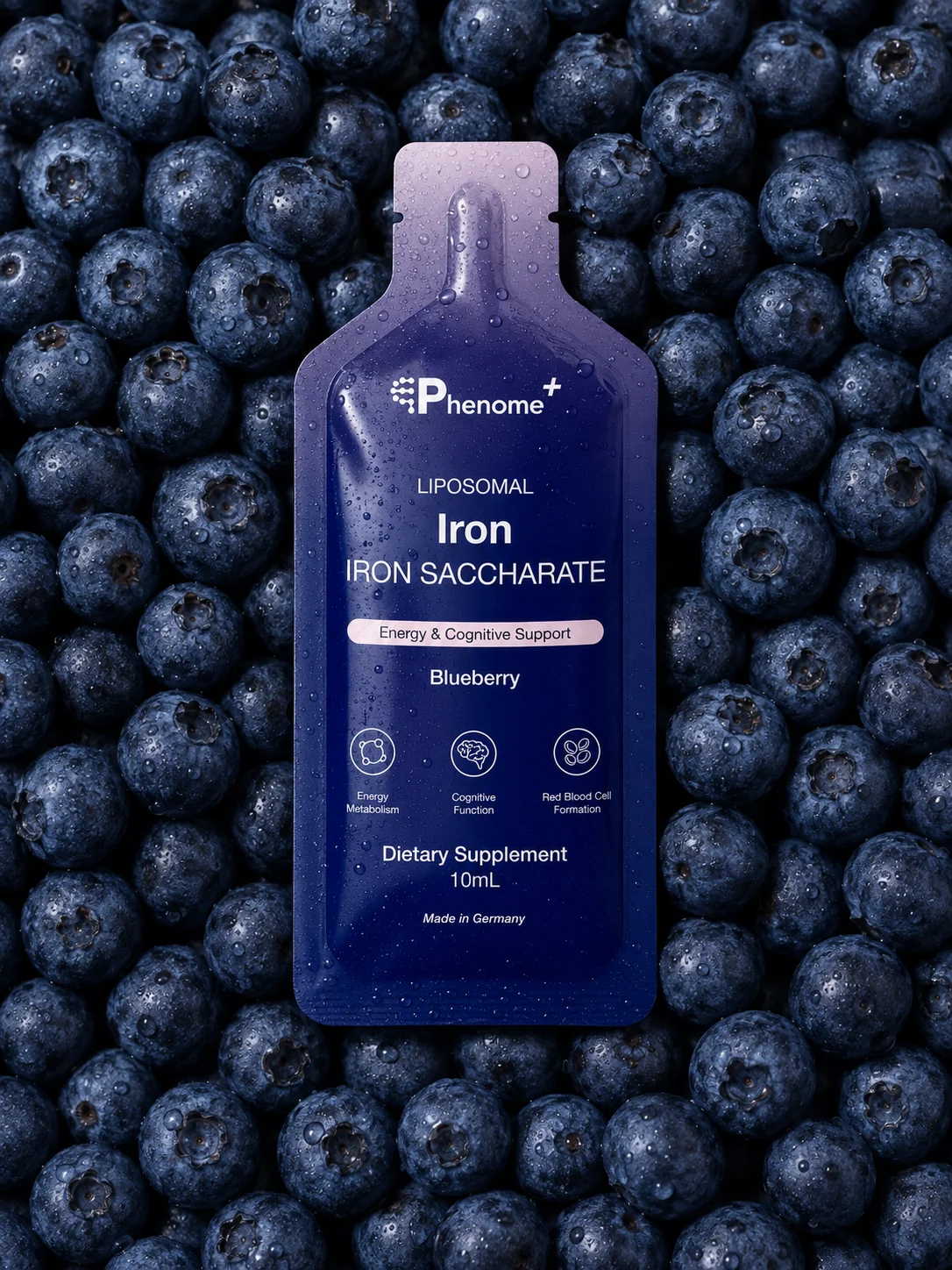 A sachet of Liposomal Iron lying on blueberries