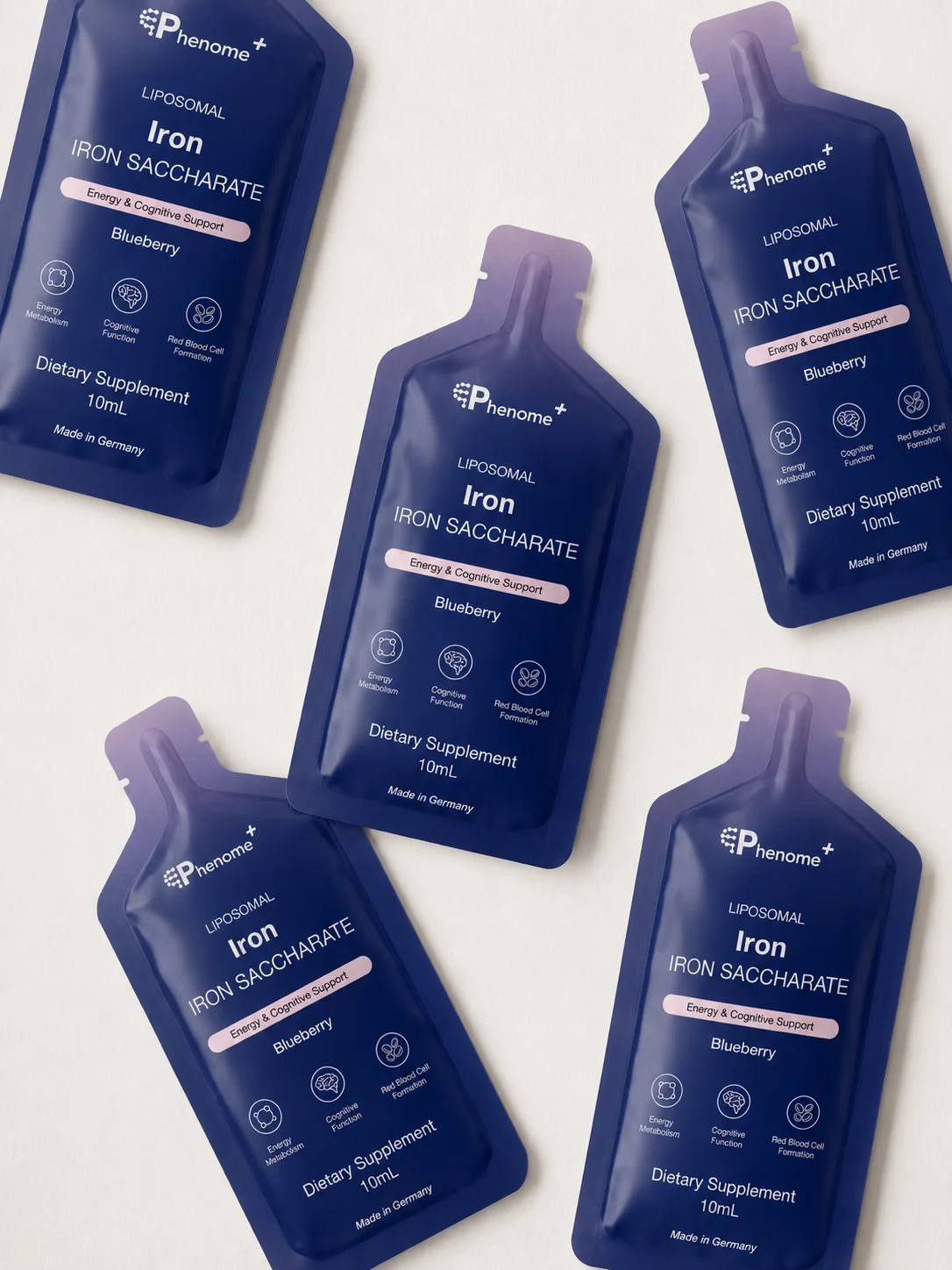 Sachets of Liposomal Iron scattered on a pale surface