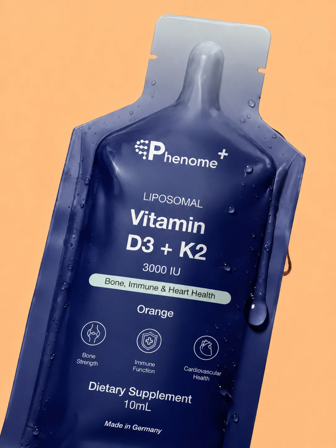A sachet of Phenome+ Liposomal Vitamin D3+K2 with drops of water on it, close up