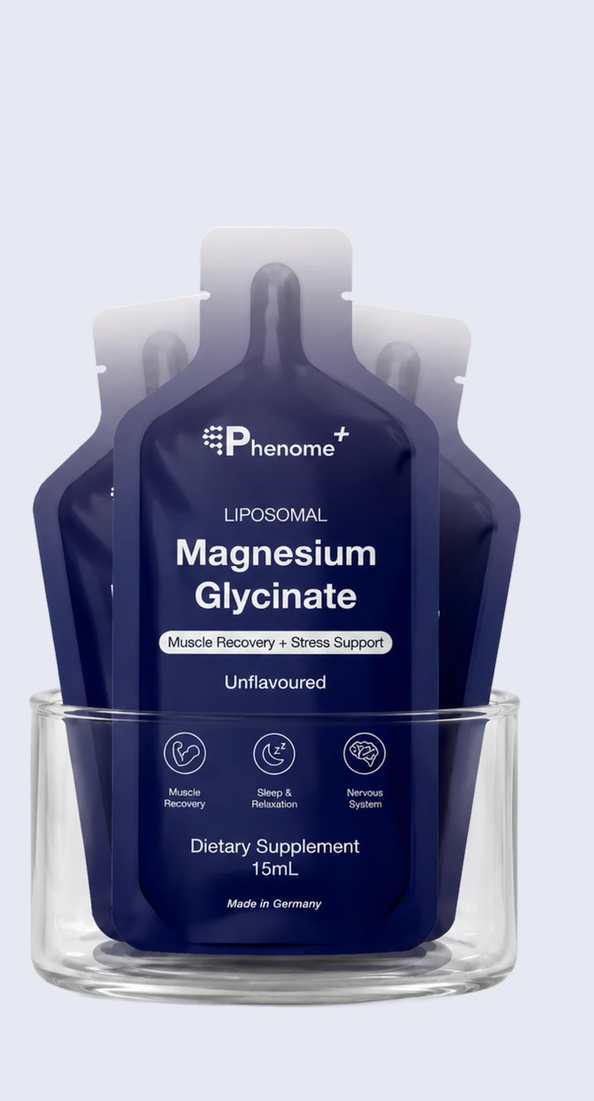 Sachets of Phenome+ Liposomal Magnesium standing in a glass